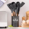 12 Pcs Silicone Cooking Utensils Set in black with wooden handles in utensil holder on kitchen counter