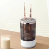 Modern electric makeup brush cleaner with rose gold brushes placed in silicone slots, suitable for home vanity setups.