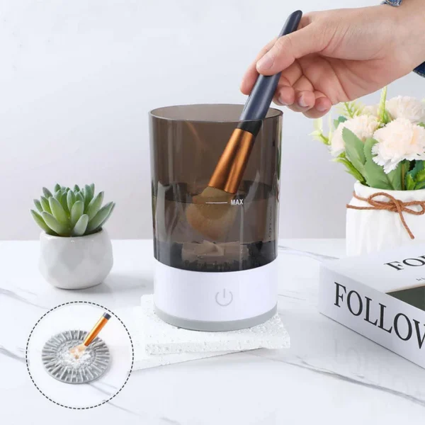 Hands-on use of electric makeup brush cleaner showing brush insertion and effective deep cleansing in water.
