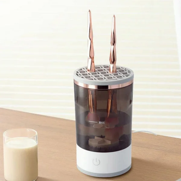 Modern electric makeup brush cleaner with rose gold brushes placed in silicone slots, suitable for home vanity setups.
