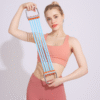 Fitness woman demonstrating 5-tube silicone adjustable chest expander for strength training
