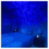 Galaxy projector starry night light creating blue nebula and star effects on bedroom ceiling and walls