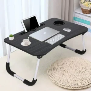 Multipurpose laptop table with foldable legs, holding laptop, tablet, keyboard, and coffee cup