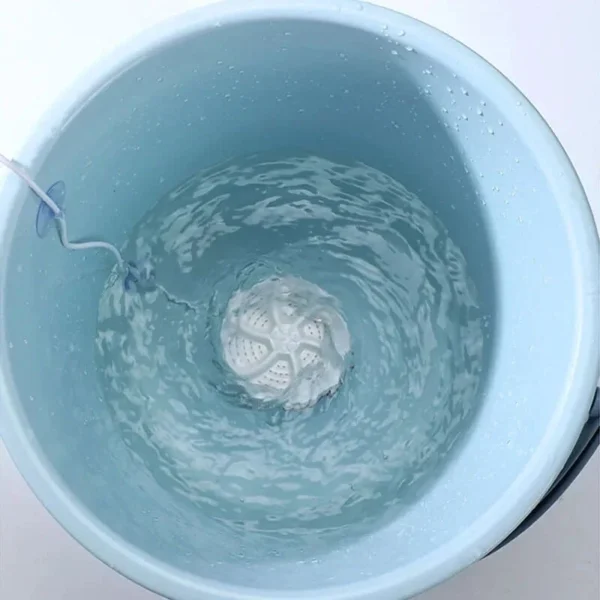 Mini ultrasonic turbine washing machine creating powerful water swirl in bucket