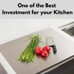 Stainless steel cutting board with tomatoes, greens, and kitchen knife