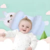 Happy baby lying on ergonomic baby shaping pillow with side support and bunny design