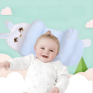 Happy baby lying on ergonomic baby shaping pillow with side support and bunny design