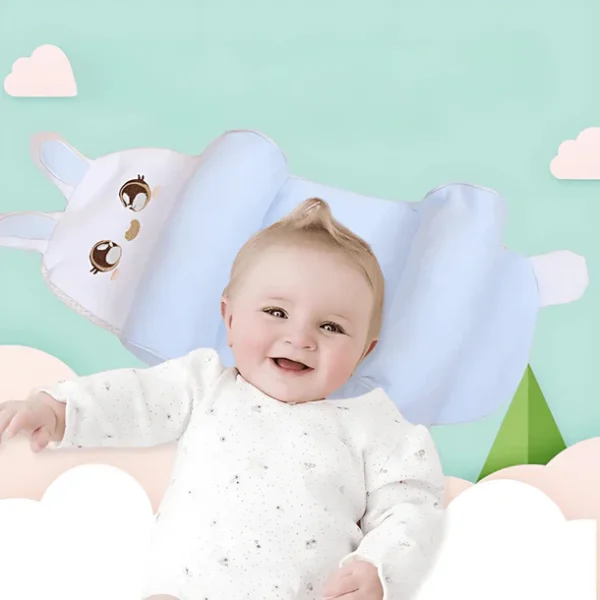 Happy baby lying on ergonomic baby shaping pillow with side support and bunny design