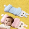Baby using blue animal-shaped head support pillow for flat head prevention and comfortable sleep and color pink head support pillow display