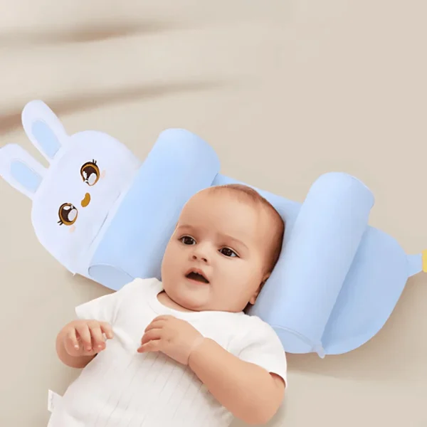 Baby using blue animal-shaped head support pillow for flat head prevention and comfortable sleep