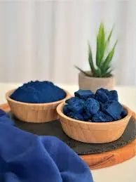 Natural Nila Powder and Indigo Chunks in Wooden Bowls – Organic Skin Brightening Ingredient.